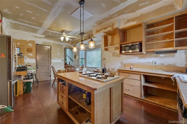 a kitchen with stainless steel appliances granite countertop a stove and a sink