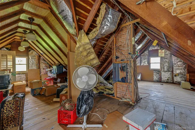 a view of a house with a chairs in a patio