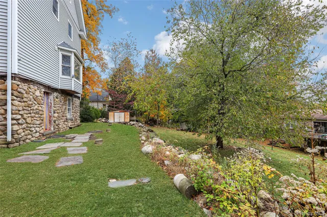 a backyard of a house with lots of green space