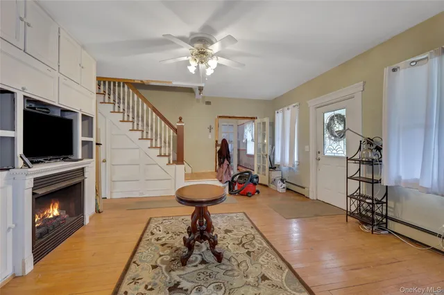 a view of a livingroom with furniture and a flat screen tv