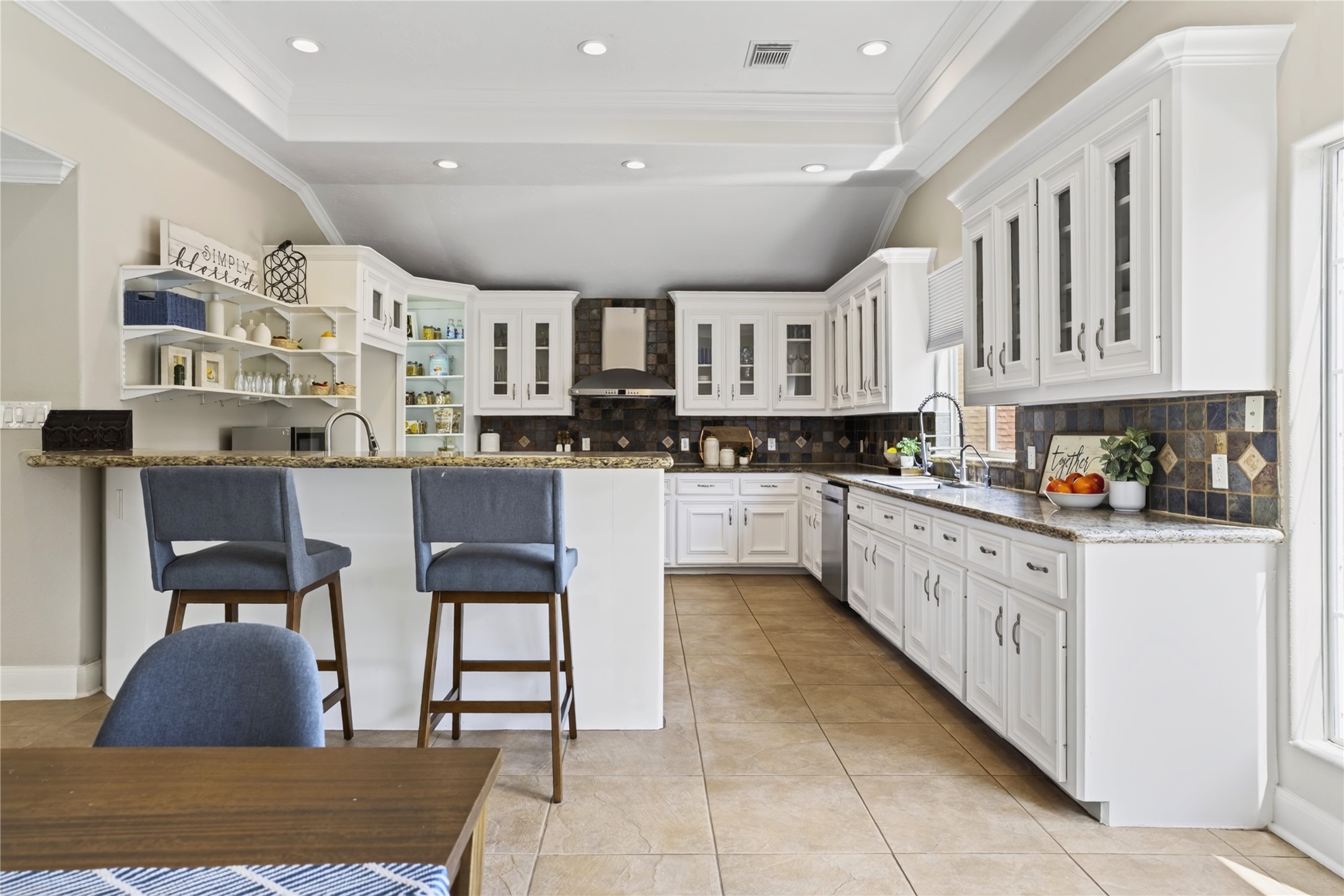 2112 Peppermill Road Houston, TX 77080 - Photo 9 of 40 This expansive kitchen, with an abundance of counter space, is truly a chef’s dream.