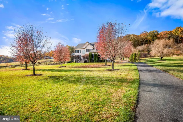 a view of a front of house with a yard