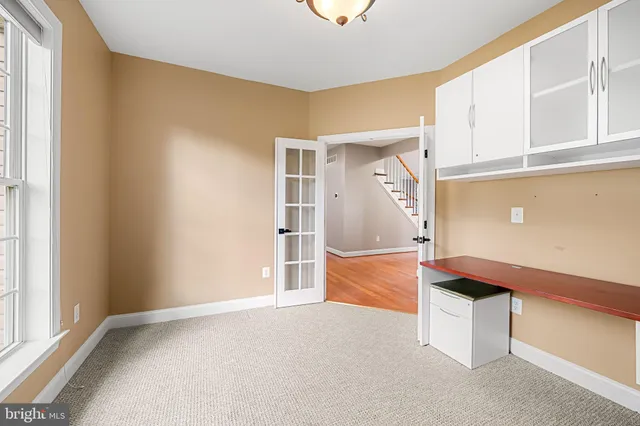 a open kitchen with stainless steel appliances granite countertop a refrigerator and a sink