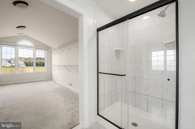 a bathroom with a granite countertop toilet a sink and a bathtub
