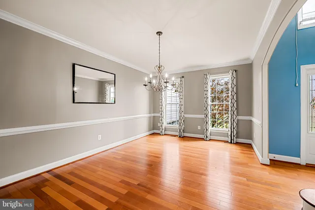 a view of kitchen with granite countertop cabinets and wooden floor