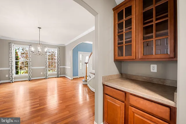 a view of a livingroom with a fireplace and wooden floor