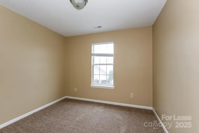 an empty room with window