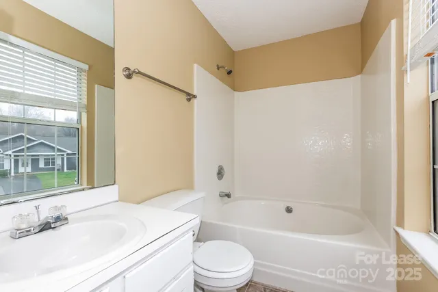 a bathroom with a sink a toilet and a bathtub