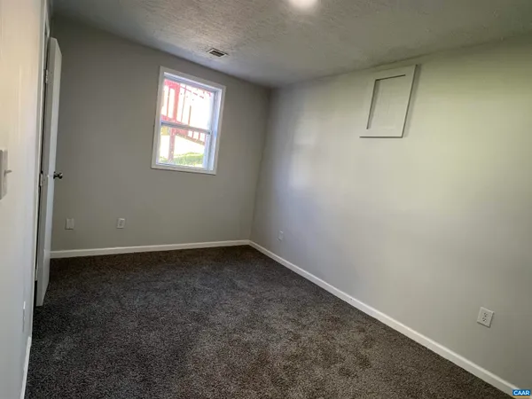a white toilet sitting next to a bath tub