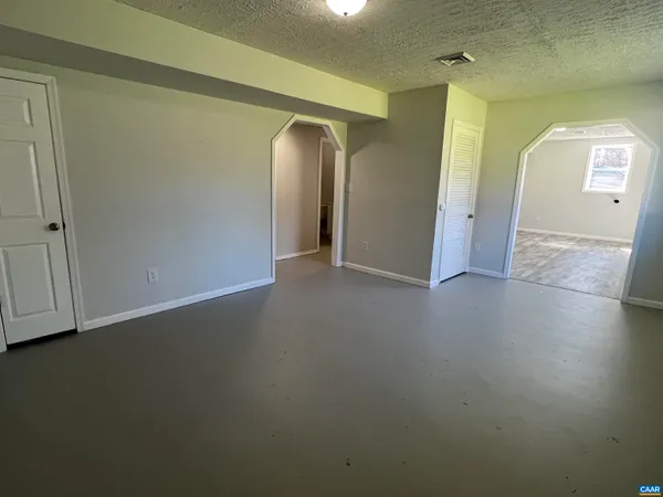 an empty room with mirror