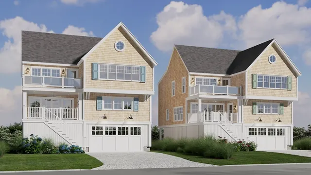 a front view of residential houses with yard