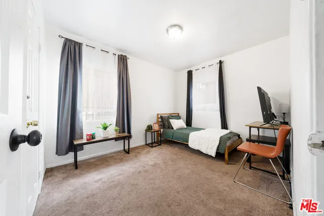 a bed room with furniture and a window