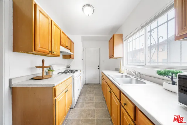 a kitchen with a sink and a window