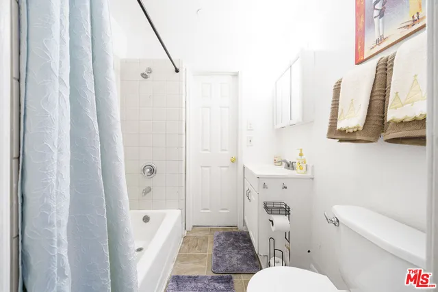 a bathroom with a toilet a sink and a bathtub