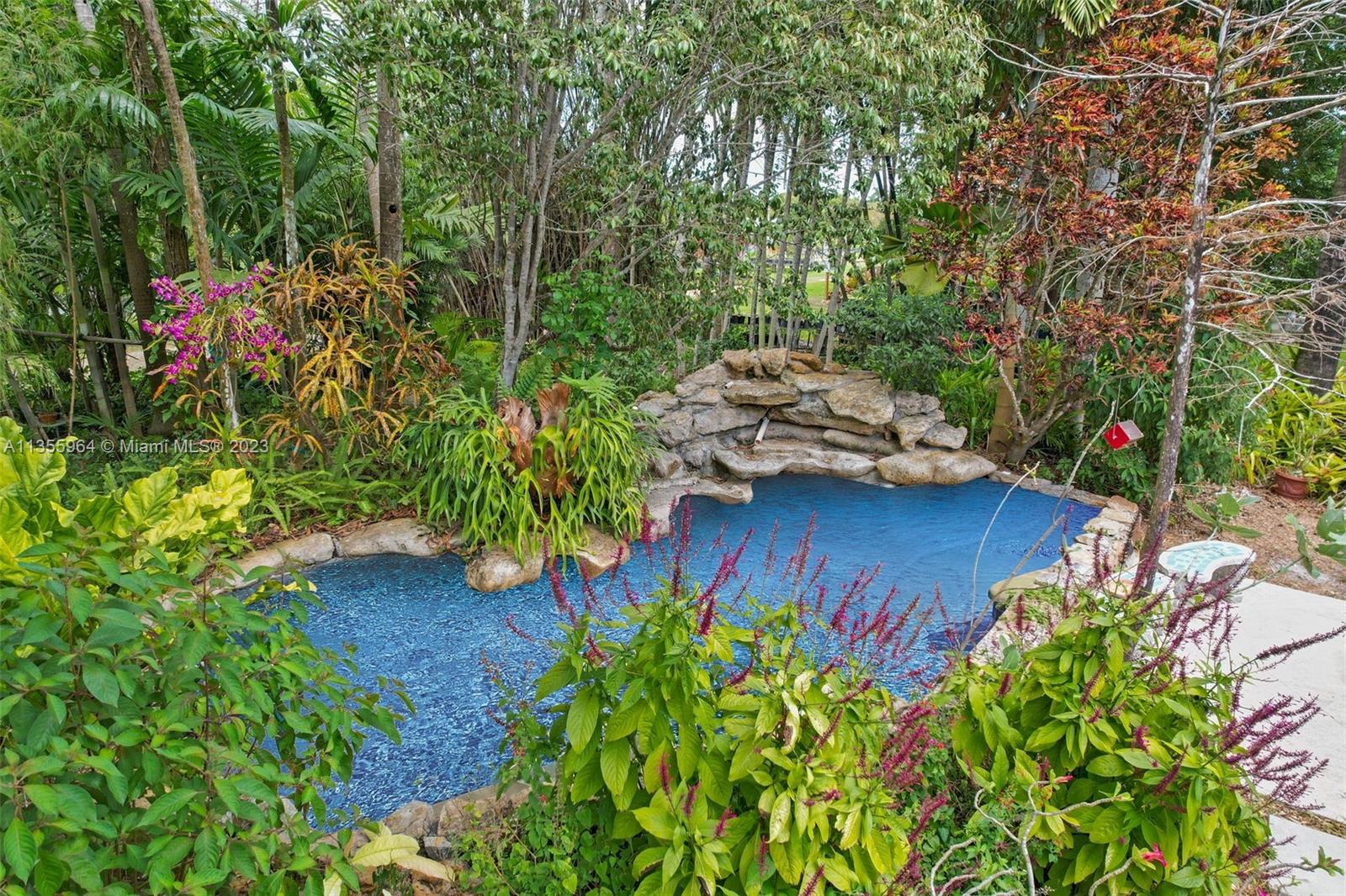 Redlands Homestead, FL 33031 - Photo 1 of 31 a view of a backyard with potted plants and large trees