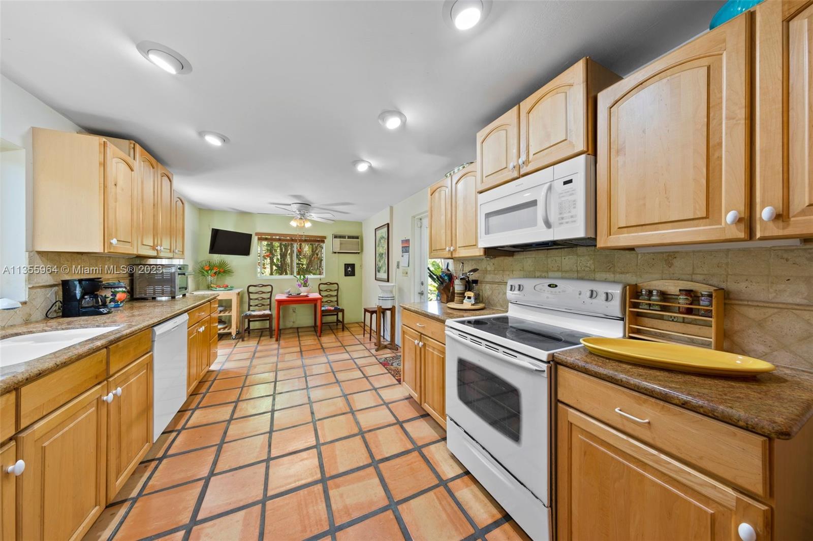 Redlands Homestead, FL 33031 - Photo 12 of 31 a kitchen with stainless steel appliances granite countertop a stove a sink and a microwave