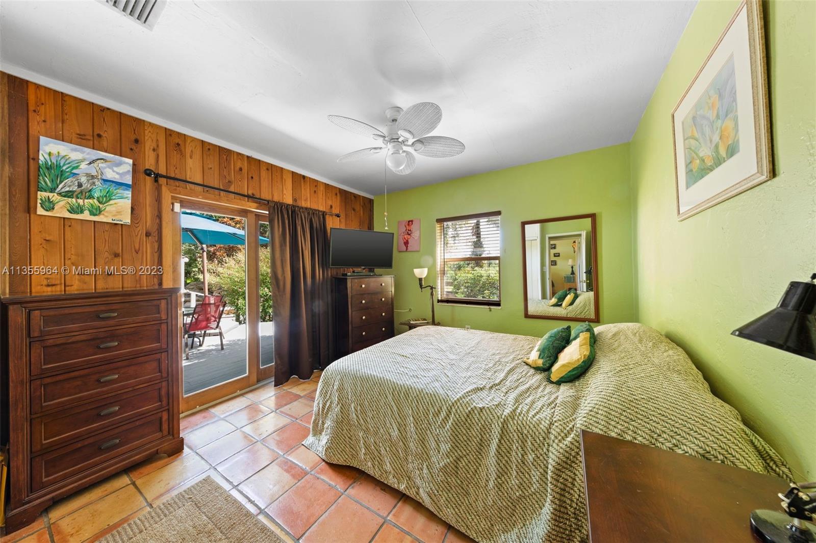 Redlands Homestead, FL 33031 - Photo 13 of 31 a bedroom with a bed dresser and a window