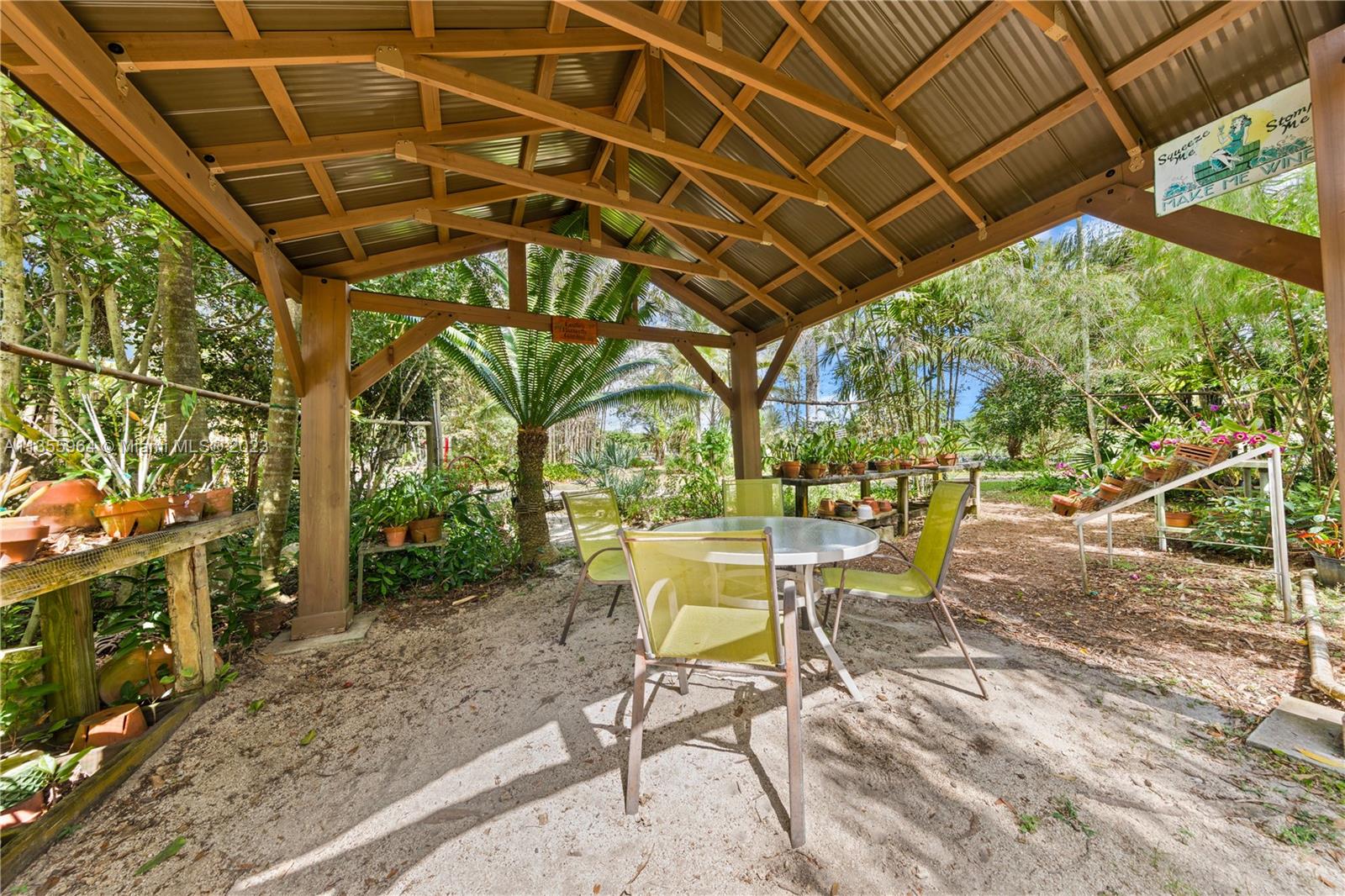 Redlands Homestead, FL 33031 - Photo 22 of 31 a view of a patio with table and chairs and potted plants