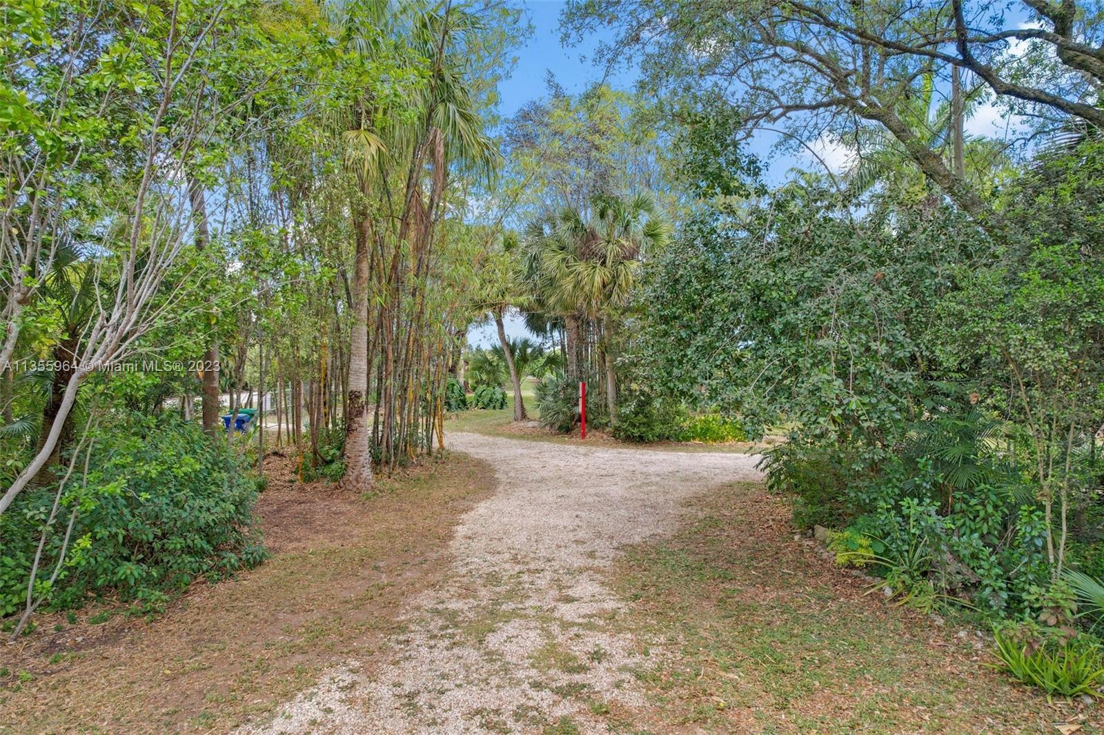 Redlands Homestead, FL 33031 - Photo 26 of 31 a view of a road with plants and trees
