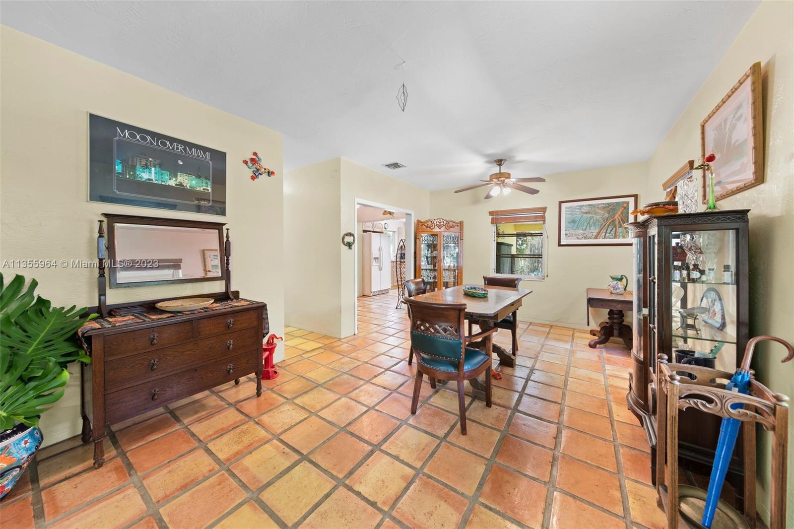 Redlands Homestead, FL 33031 - Photo 5 of 31 a living room with furniture a flat screen tv and a dining table