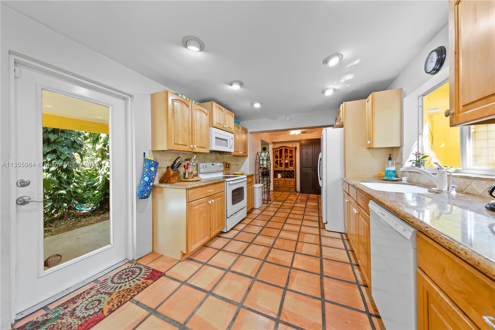 Redlands Homestead, FL 33031 - Photo 10 of 31 a kitchen with stainless steel appliances granite countertop a stove a sink and a refrigerator