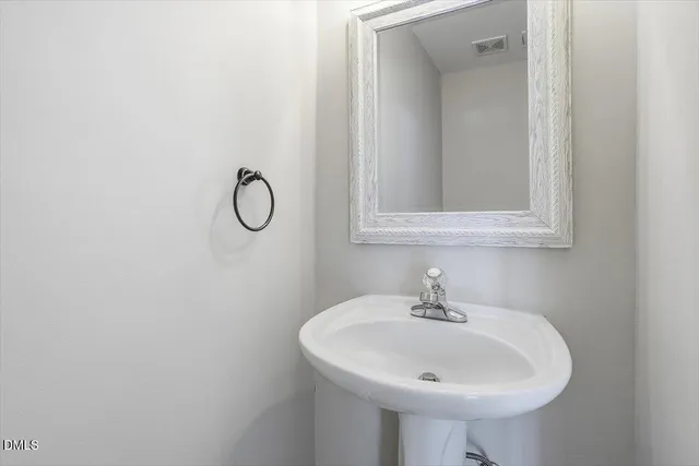 a kitchen with stainless steel appliances a stove sink and cabinets