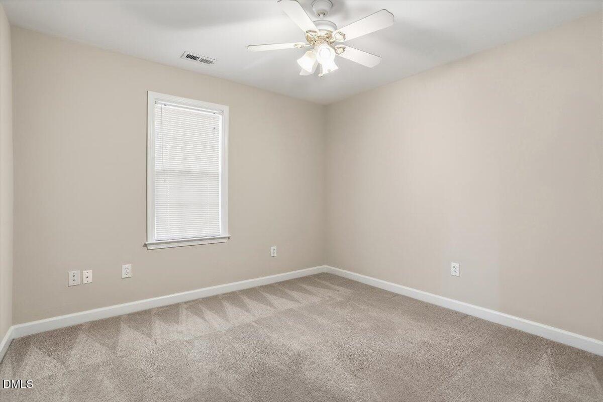 2220 Trailwood Valley Circle Raleigh, NC 27603 - Photo 27 of 37 an empty room with a window