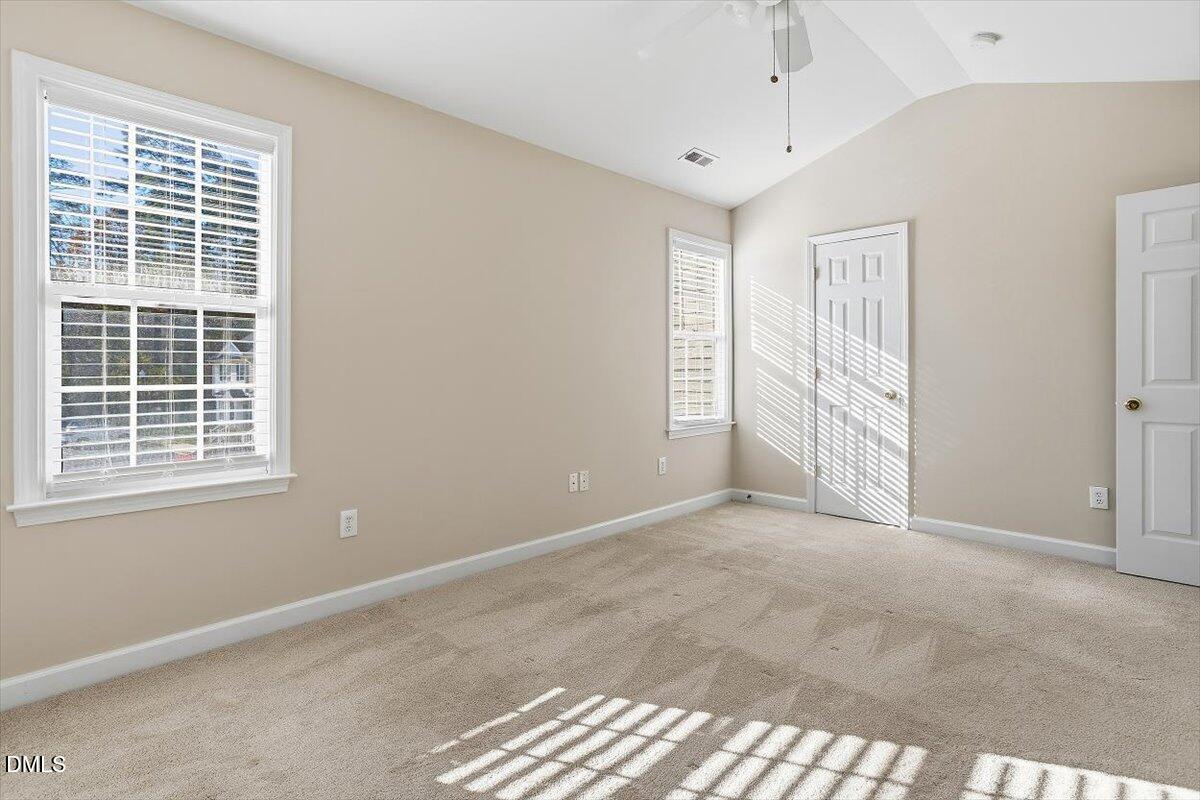 2220 Trailwood Valley Circle Raleigh, NC 27603 - Photo 32 of 37 an empty room with windows