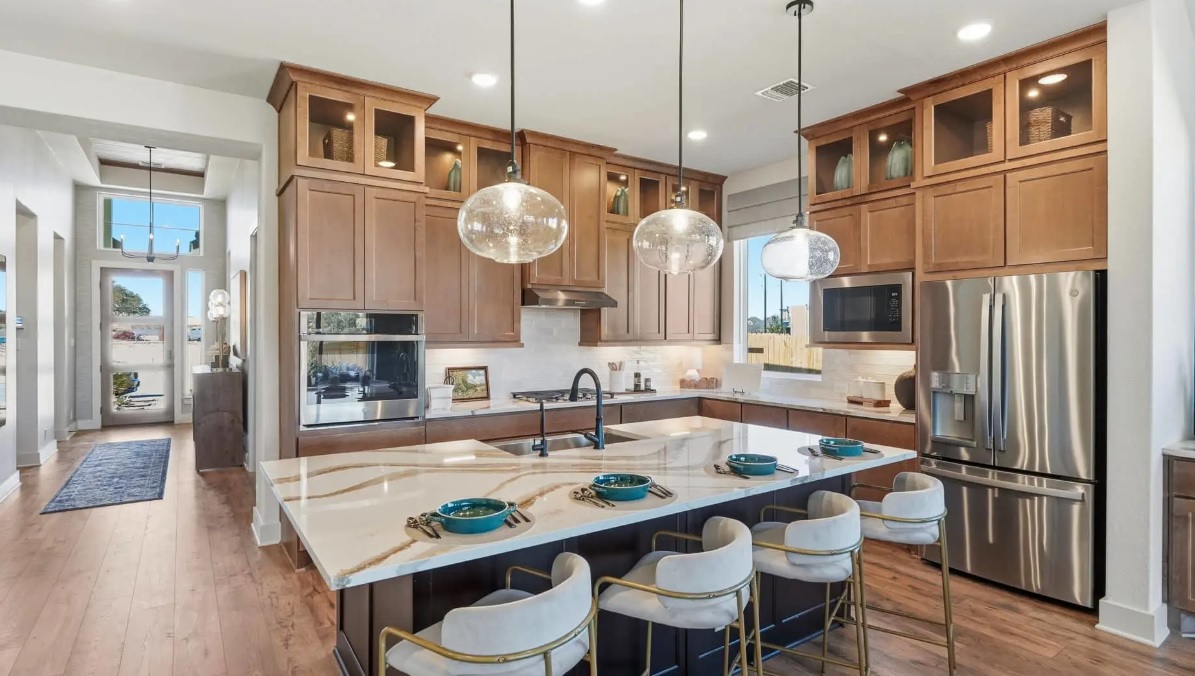 248 Prickly Poppy Way Georgetown, TX 78633 - Photo 3 of 21 Culinary aspirations meet contemporary design in this generously appointed kitchen, ideal for entertaining.