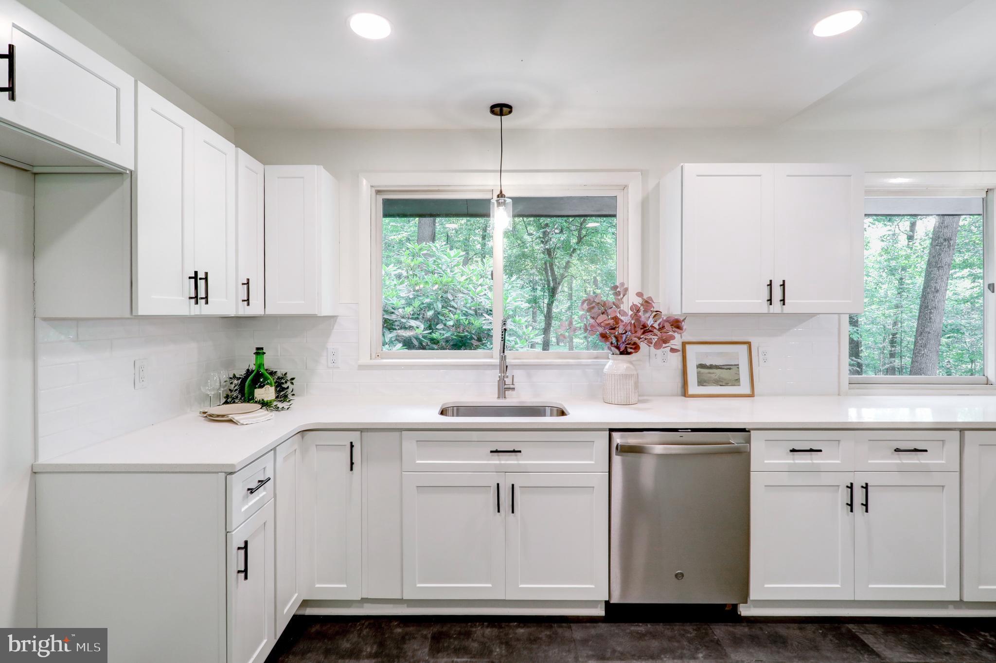 1254 Pinch Valley Road Westminster, MD 21158 - Photo 16 of 45 a kitchen with white cabinets and white appliances