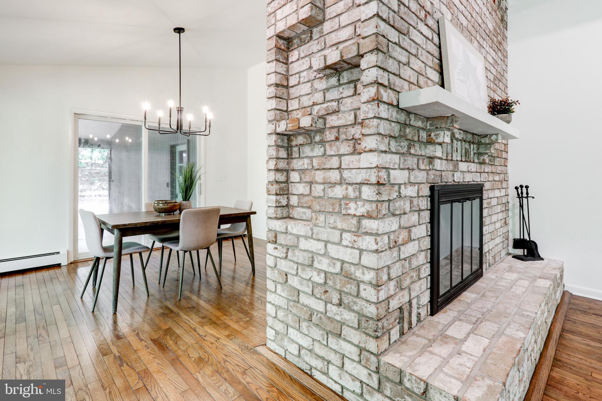 1254 Pinch Valley Road Westminster, MD 21158 - Photo 18 of 45 a view of a dining room with furniture and wooden floor