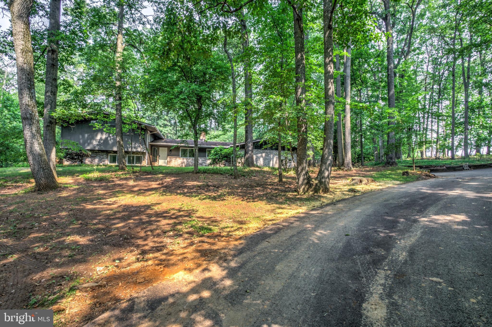 1254 Pinch Valley Road Westminster, MD 21158 - Photo 2 of 45 a backyard of a house with lots of green space and fountain