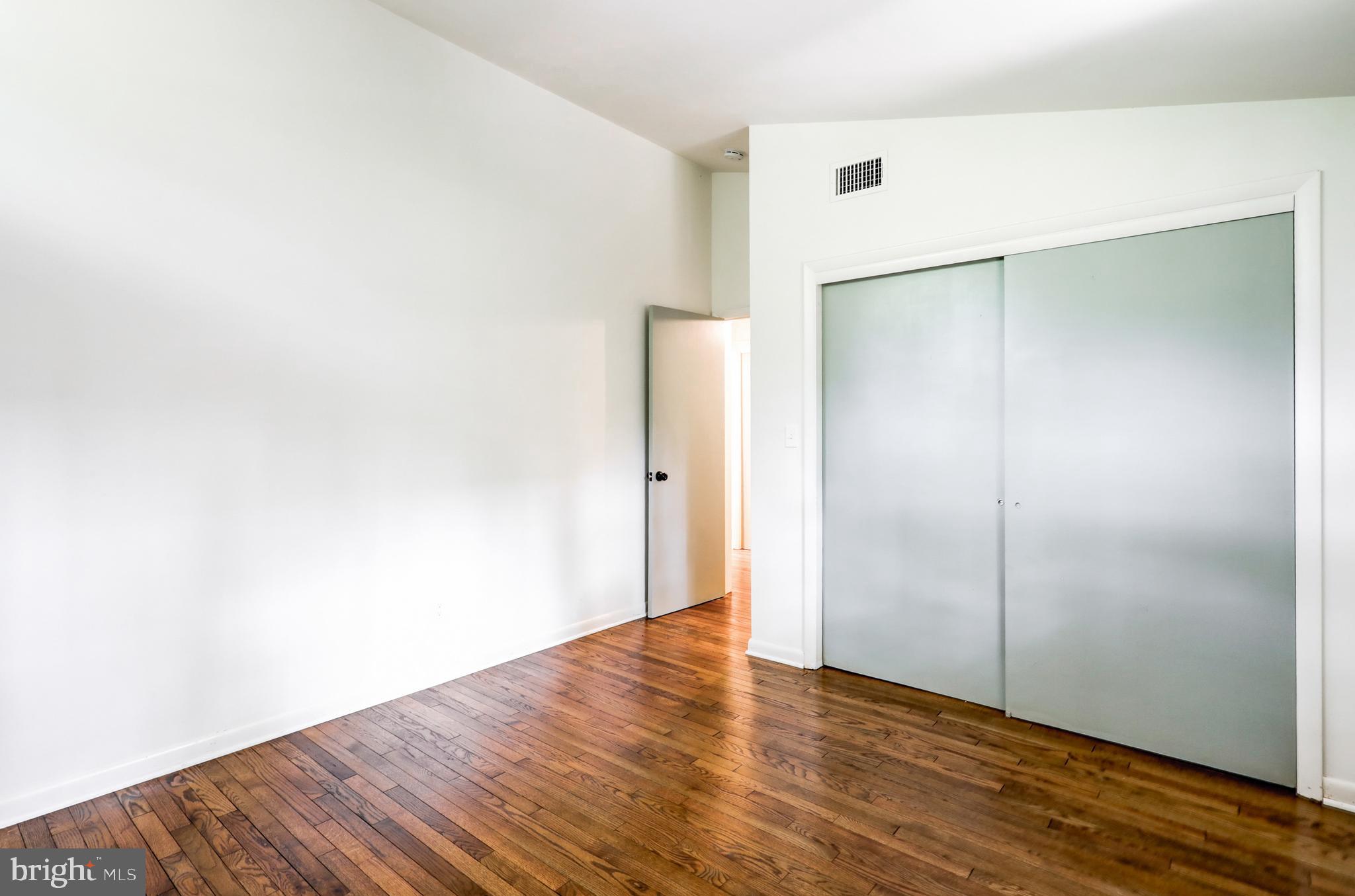 1254 Pinch Valley Road Westminster, MD 21158 - Photo 23 of 45 a view of an empty room with wooden floor