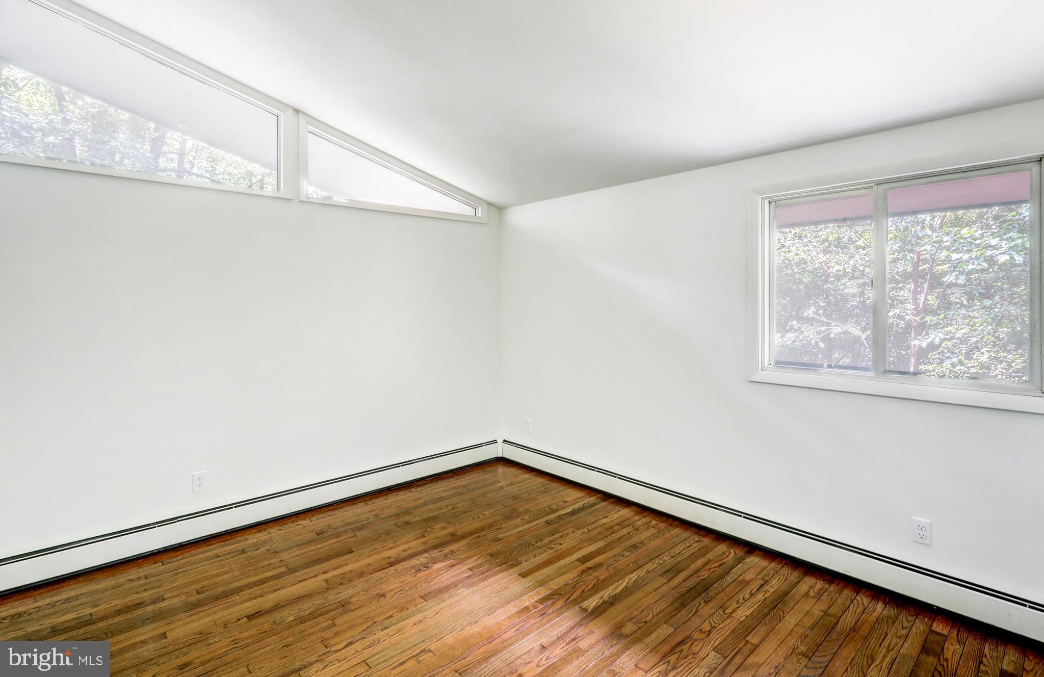 1254 Pinch Valley Road Westminster, MD 21158 - Photo 24 of 45 a view of empty room with wooden floor and fan