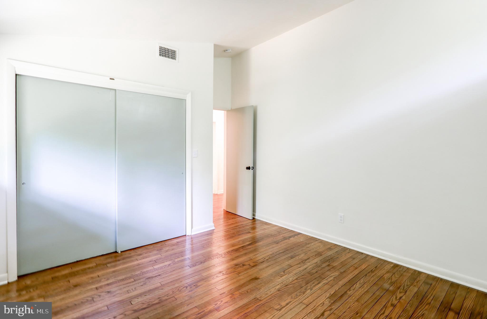 1254 Pinch Valley Road Westminster, MD 21158 - Photo 27 of 45 a view of an empty room with wooden floor
