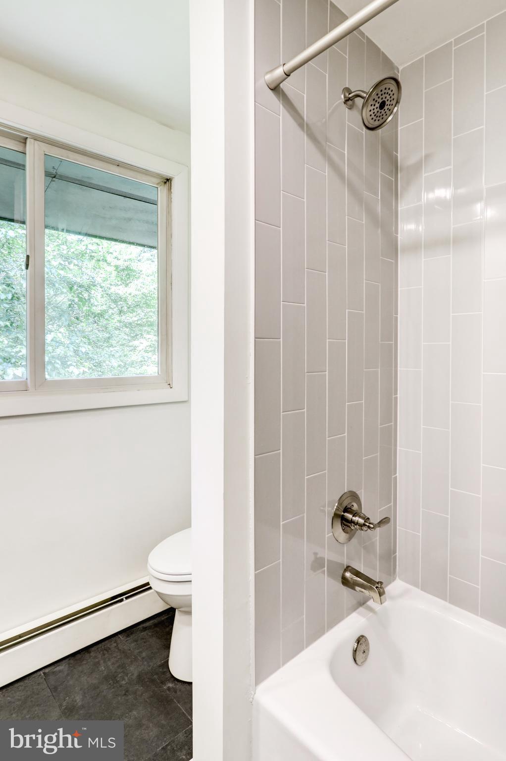 1254 Pinch Valley Road Westminster, MD 21158 - Photo 30 of 45 a bathroom with a sink a toilet and shower