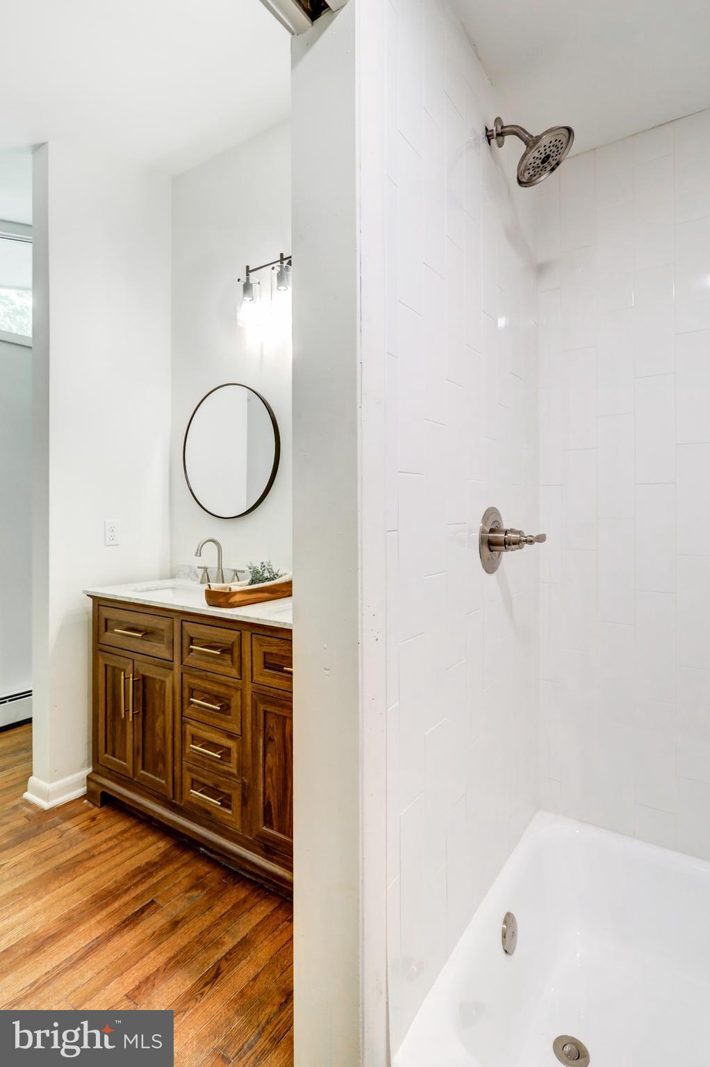 1254 Pinch Valley Road Westminster, MD 21158 - Photo 33 of 45 a bathroom with a tub sink and mirror