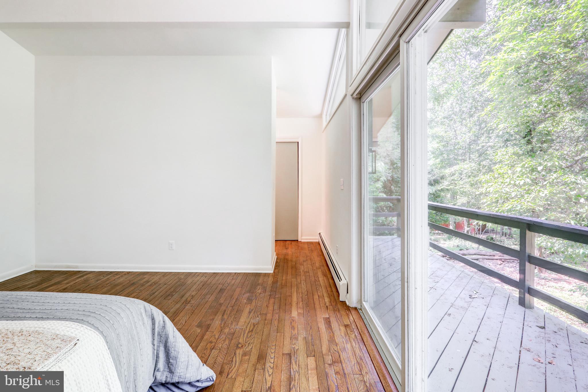 1254 Pinch Valley Road Westminster, MD 21158 - Photo 34 of 45 a view of walk in closet with wooden floor