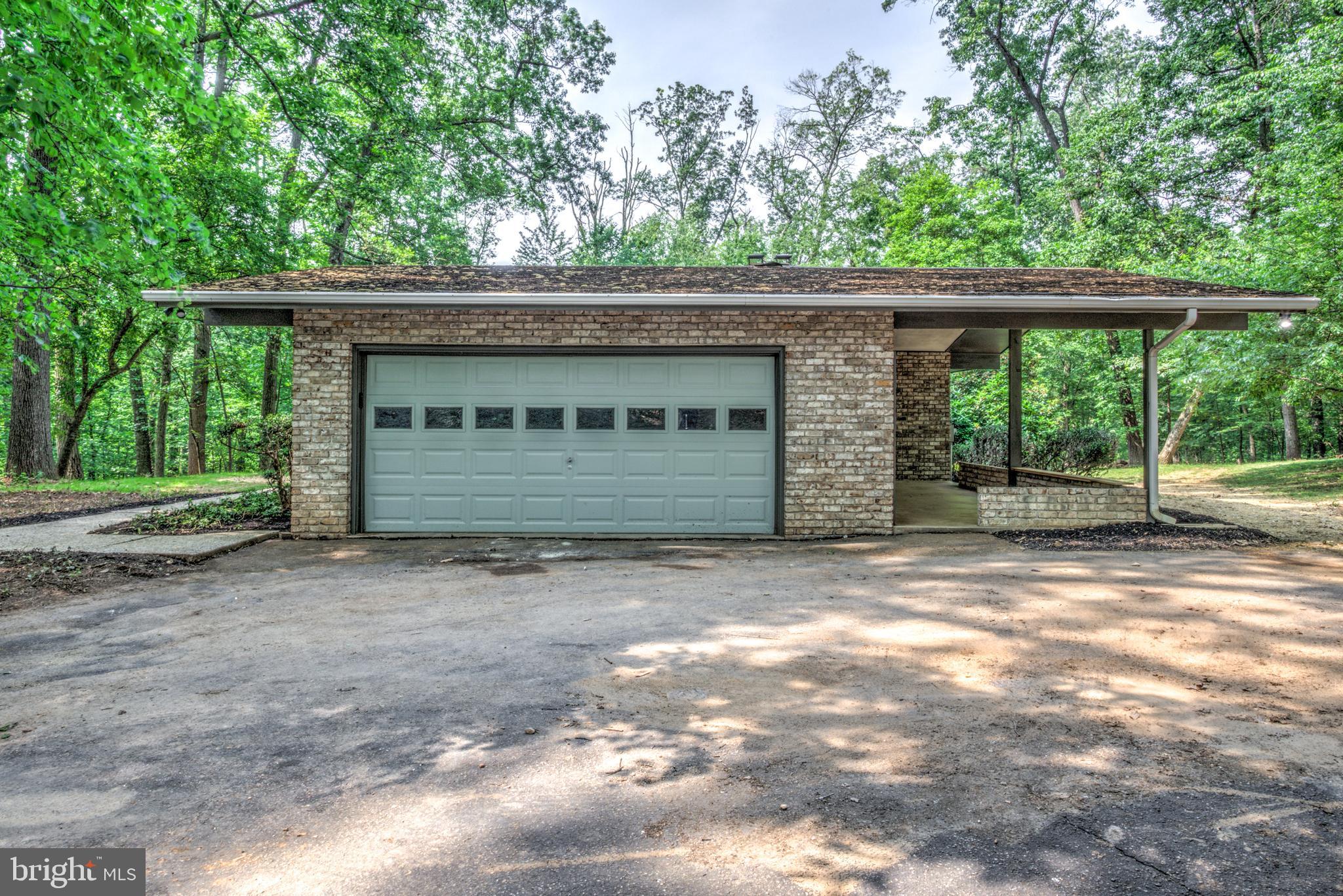 1254 Pinch Valley Road Westminster, MD 21158 - Photo 9 of 45 a front view of a house with a garden