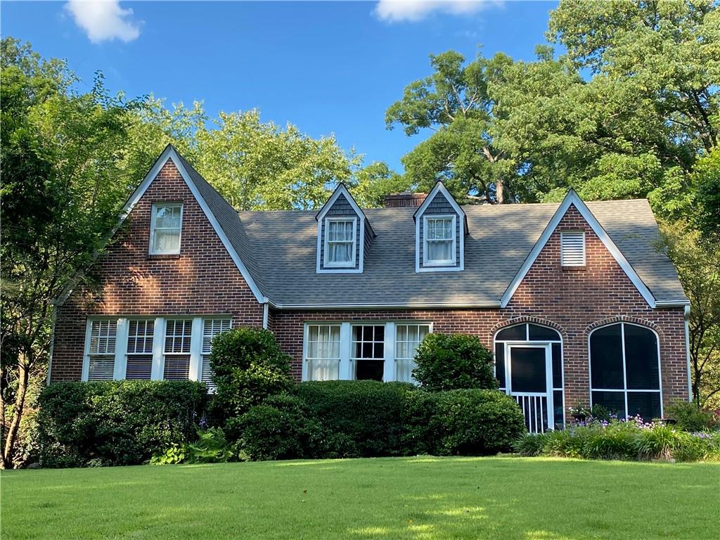1729 East Clifton Road Northeast Atlanta, GA 30307 - Photo 1 of 1 a front view of a house with a yard