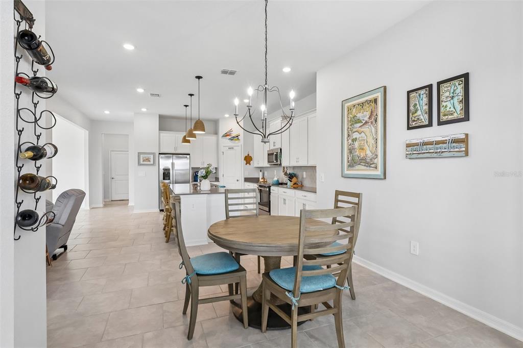 6049 Claystone Way Mount Dora, FL 32757 - Photo 11 of 55 a dining room with furniture and window
