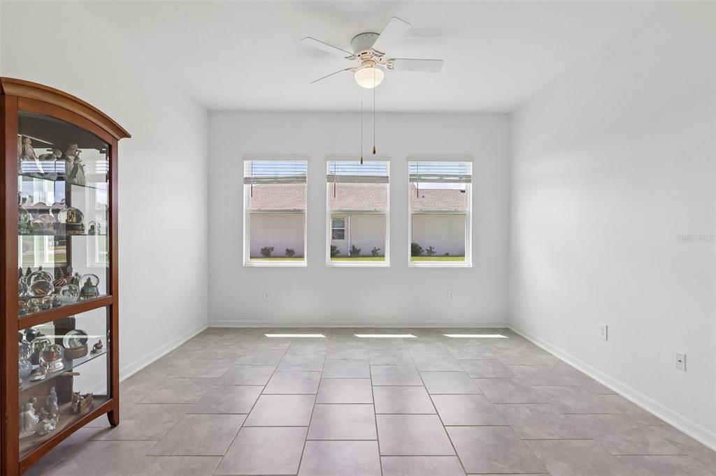 6049 Claystone Way Mount Dora, FL 32757 - Photo 18 of 55 a view of an empty room with a window