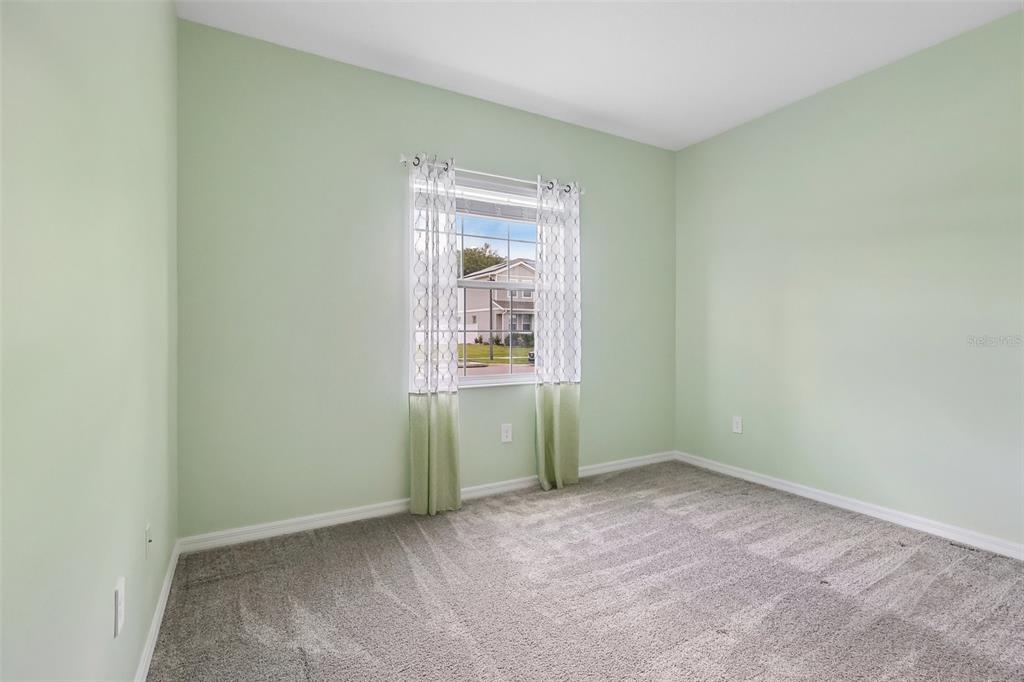 6049 Claystone Way Mount Dora, FL 32757 - Photo 33 of 55 an empty room with closet and windows