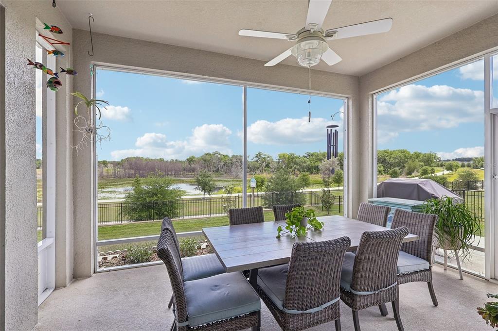 6049 Claystone Way Mount Dora, FL 32757 - Photo 37 of 55 a view of a dining room with furniture window and outside view