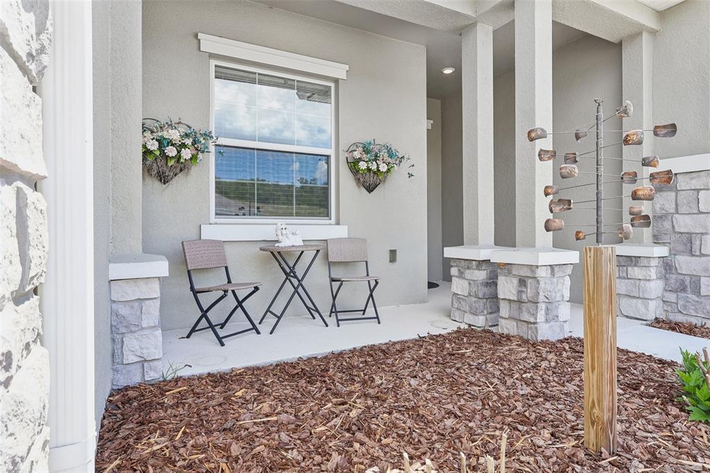 6049 Claystone Way Mount Dora, FL 32757 - Photo 4 of 55 a bedroom with a bed and a window