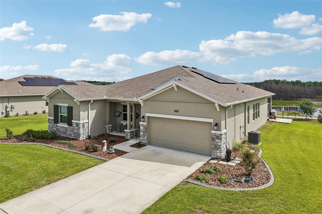 6049 Claystone Way Mount Dora, FL 32757 - Photo 42 of 55 a view of a house with backyard