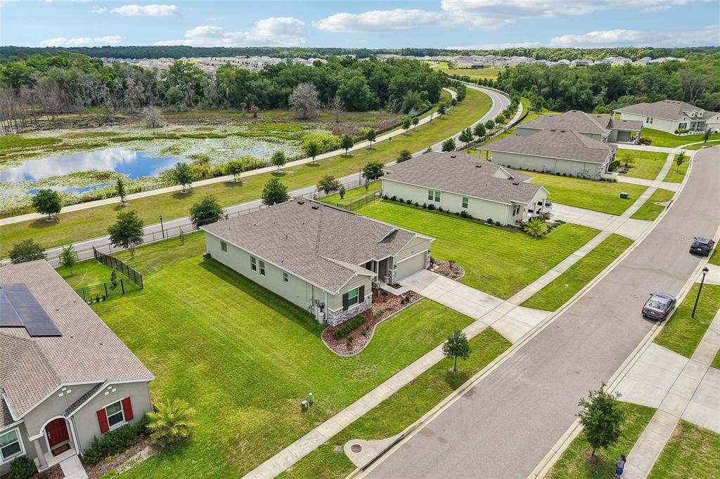 6049 Claystone Way Mount Dora, FL 32757 - Photo 44 of 55 an aerial view of a house with a big yard