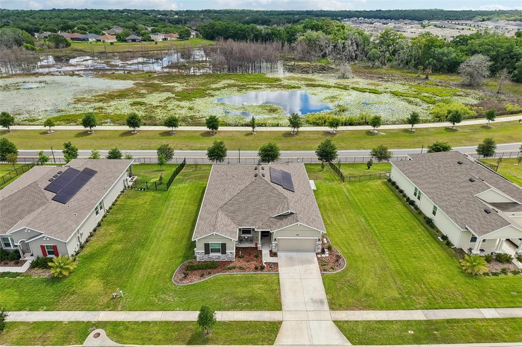 6049 Claystone Way Mount Dora, FL 32757 - Photo 45 of 55 an aerial view of a residential houses with outdoor space and lake view