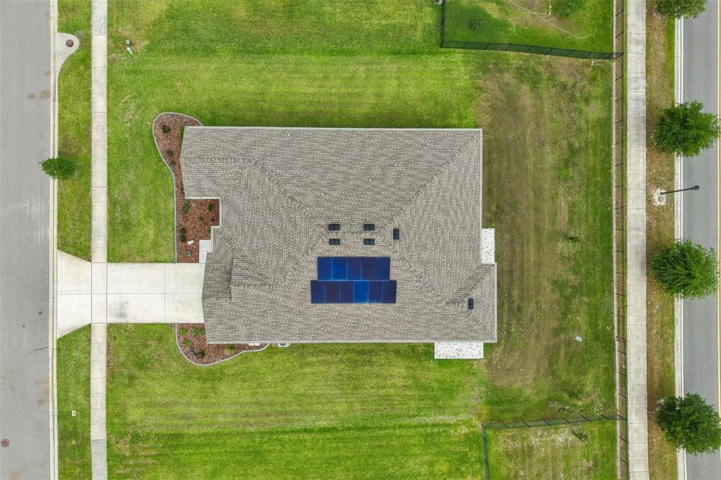 6049 Claystone Way Mount Dora, FL 32757 - Photo 53 of 55 a aerial view of a house with a yard