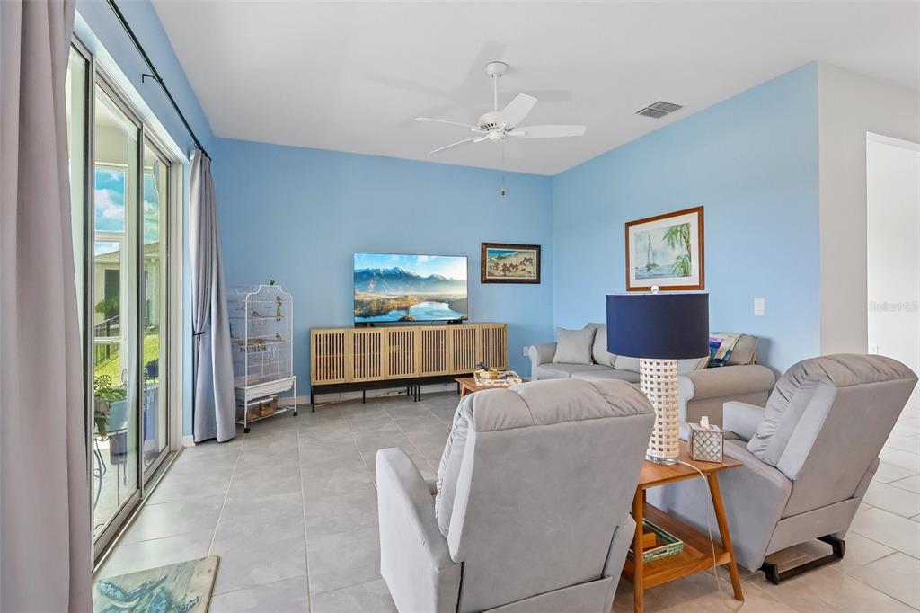 6049 Claystone Way Mount Dora, FL 32757 - Photo 9 of 55 a living room with furniture and a window